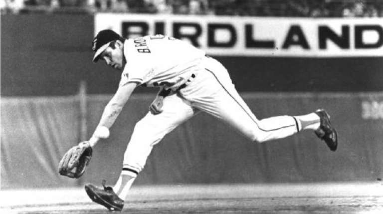 Brooks Robinson stretching to field a ground ball.