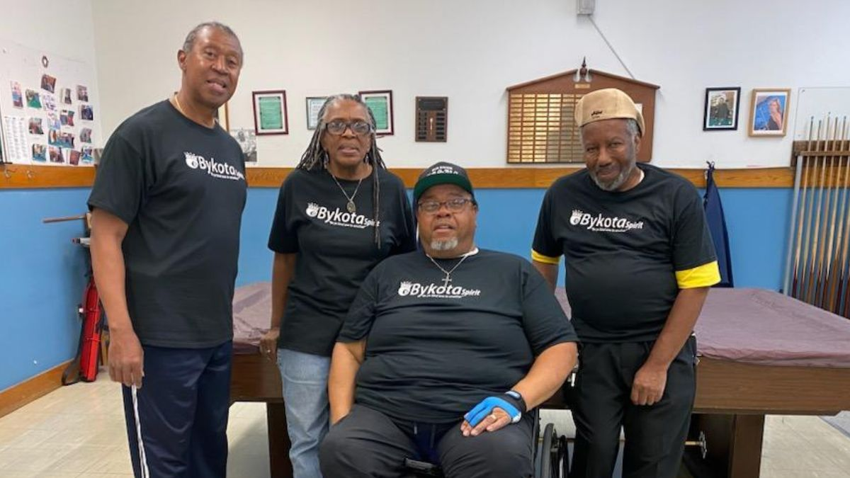 Image of four regular billiard players